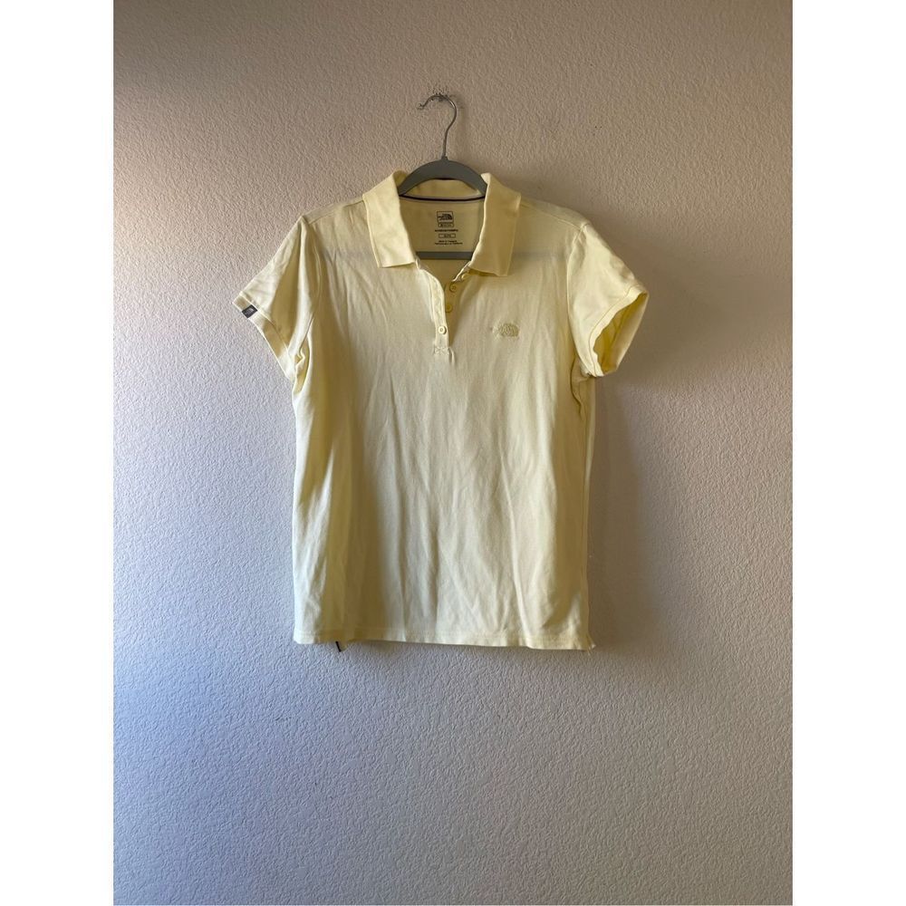 The north face women’s yellow shirt sleeve polo size xl